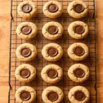 A close-up overhead shot of a dozen mini peanut butter cup cookies